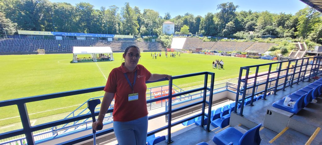 Andrea Herbei standing in front of stadium