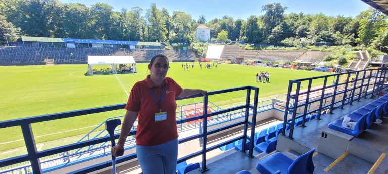 Andrea Herbei standing in front of stadium
